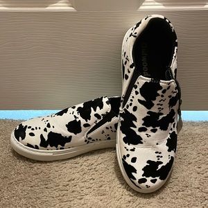 Cow print slip ons
